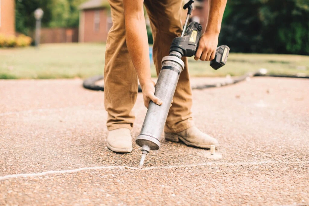 A TFS contractor using Nexus Pro to seal a crack in a concrete