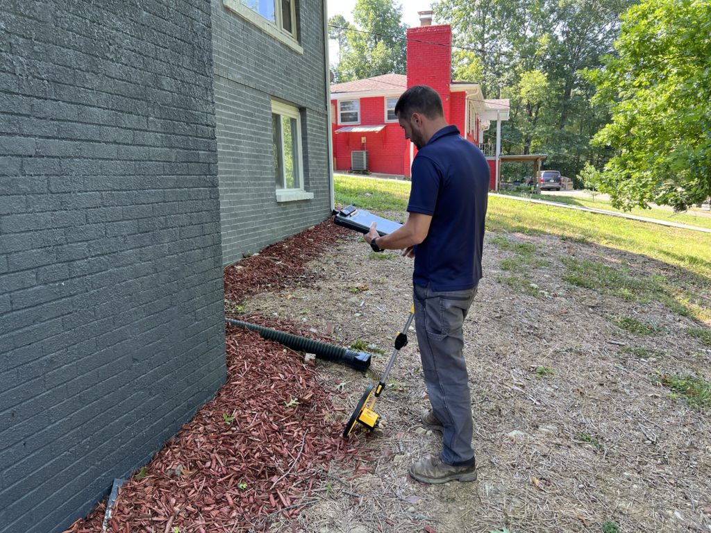 Inspecting a home's foundation from the outside