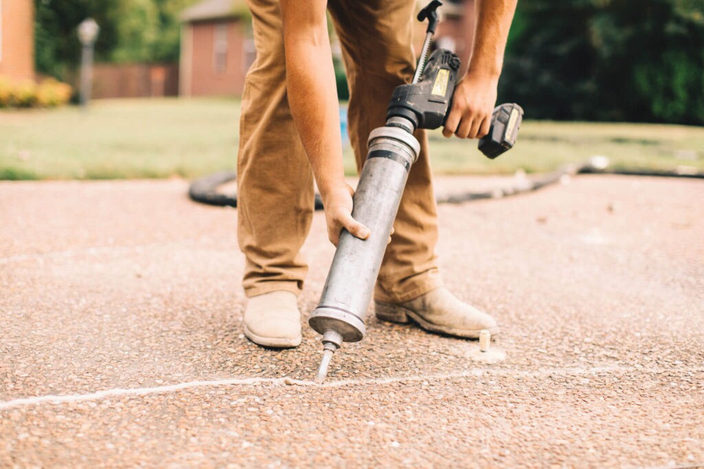 A TFS contractor using Nexus Pro to seal a crack in a concrete