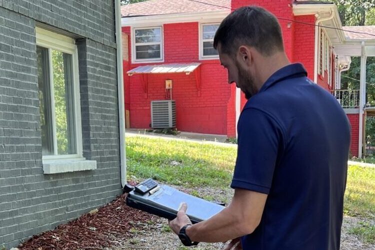 Inspecting a home's foundation from the outside